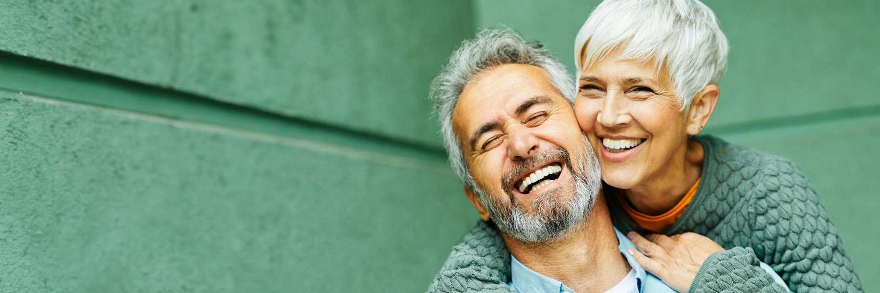 an elderly couple smiling after getting Dentures and Partials in Ocala, FL