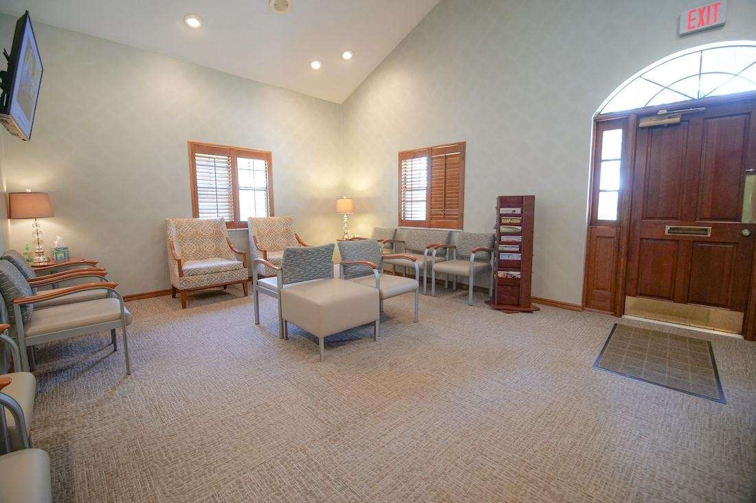 Comfortable patient waiting room at Sutton Dentistry in Ocala, FL featuring a clean, welcoming space designed for a relaxing dental visit.